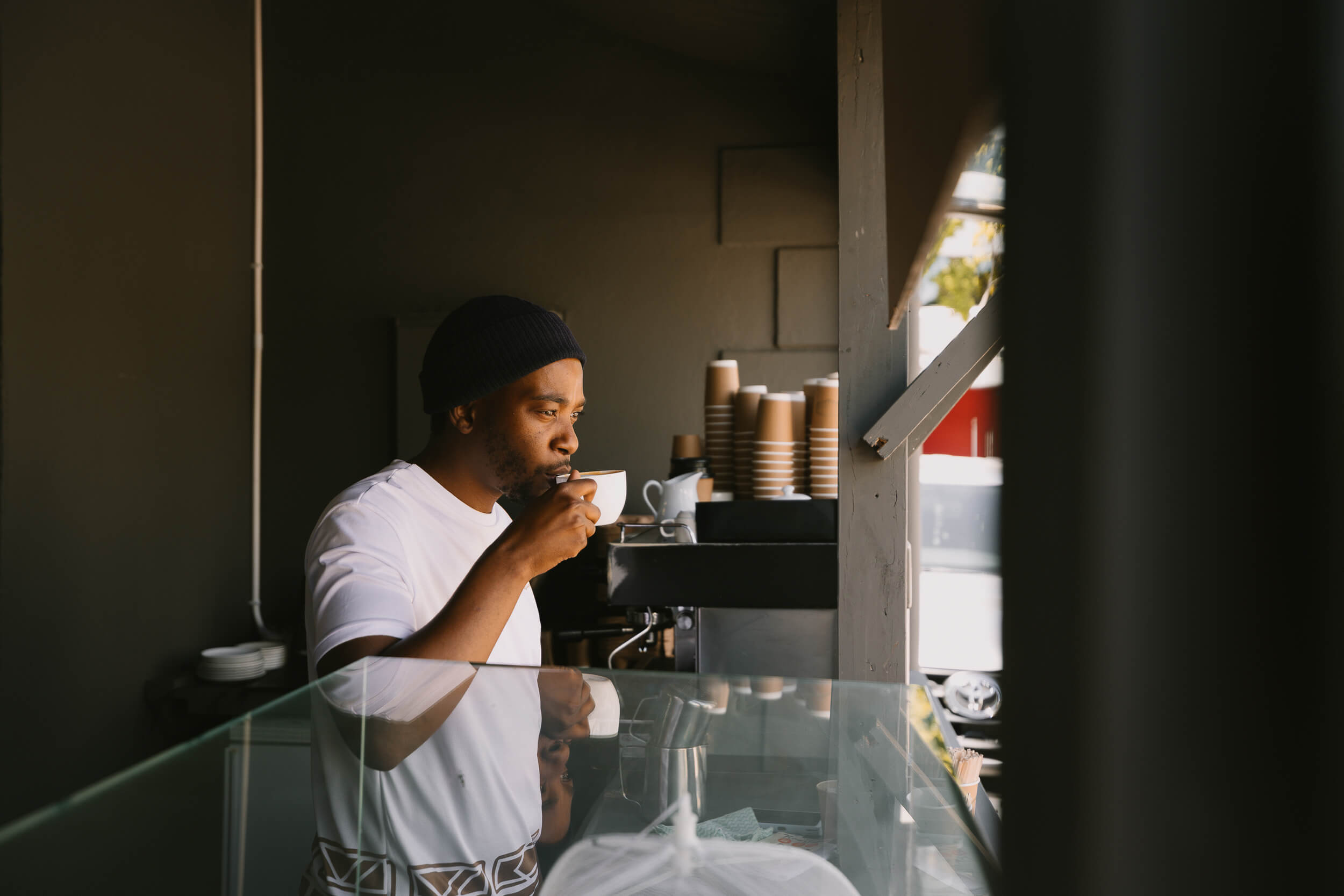 Siki's barista sipping on a coffee.