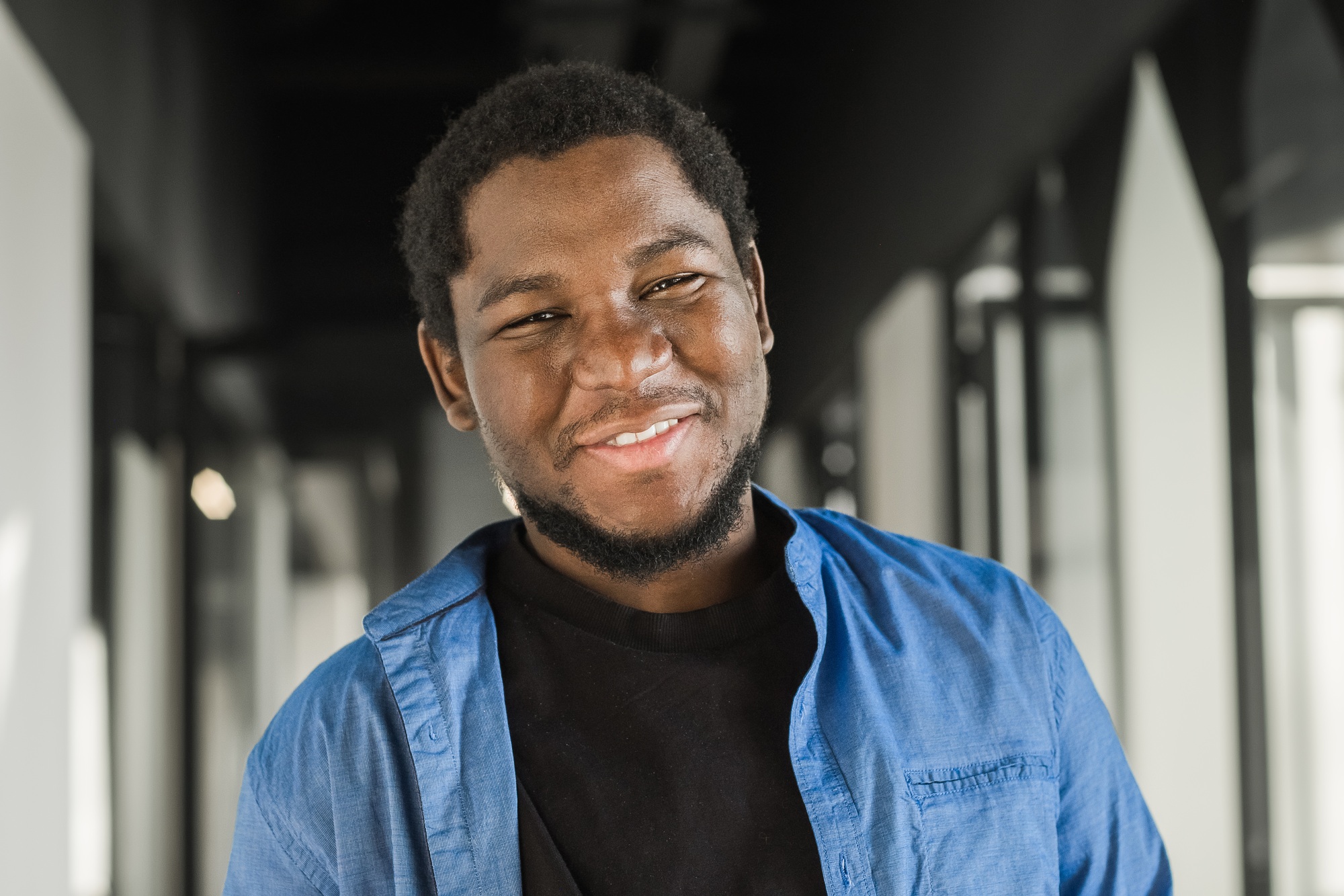 Portrait of happy African American small business owner. Millennial black male team leader smiling