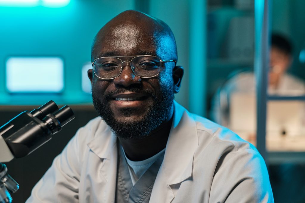 Young successful male scientist or researcher looking at camera